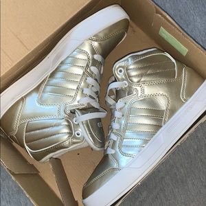 Women’s gold adidas high tops